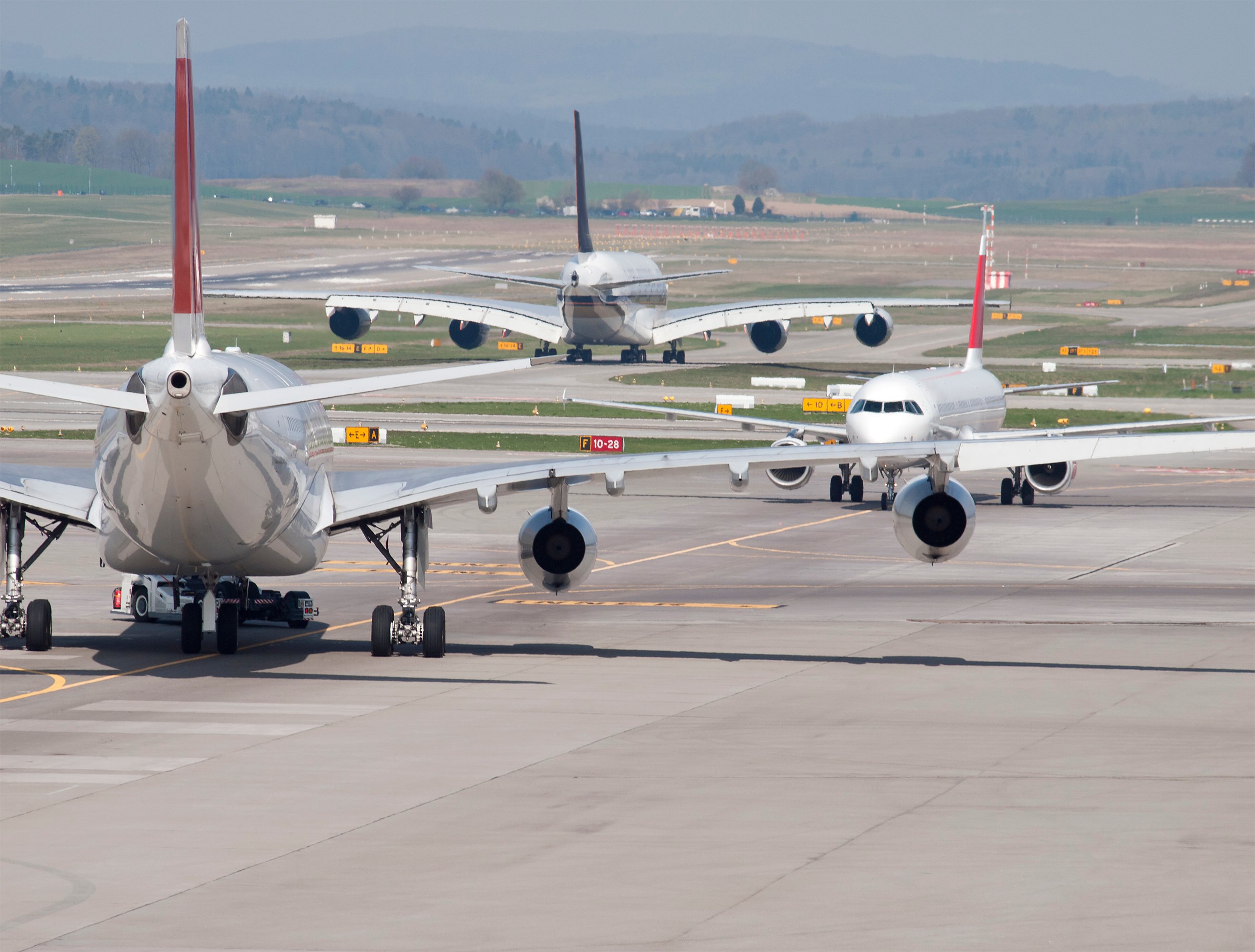Passenger jets stuck on an airport tarmac. 