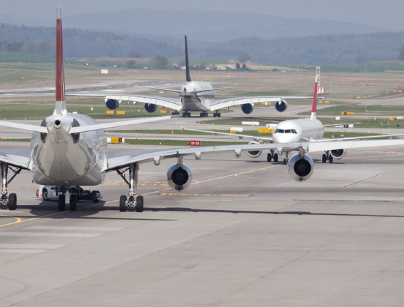 Passenger jets stuck on an airport tarmac. 