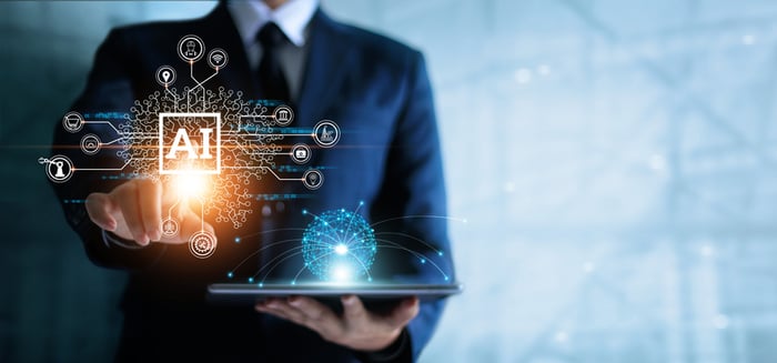 Man holding tray with computer-generated AI and other digital imagery.