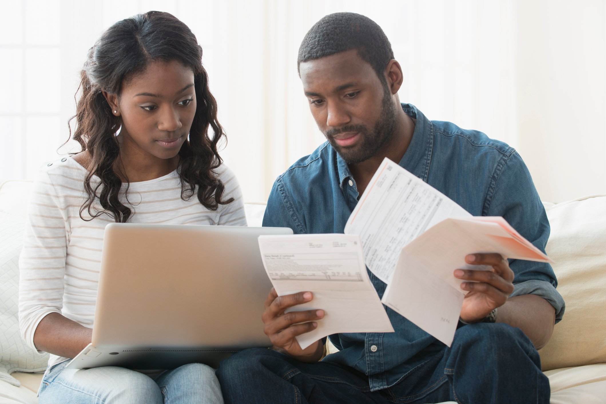 Two people looking over documents. 