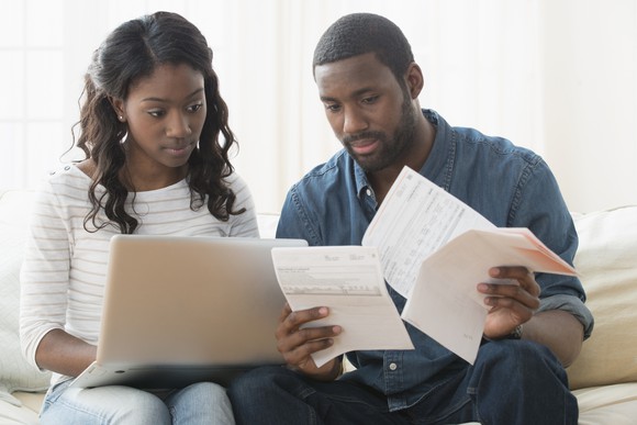 Two people looking over documents. 