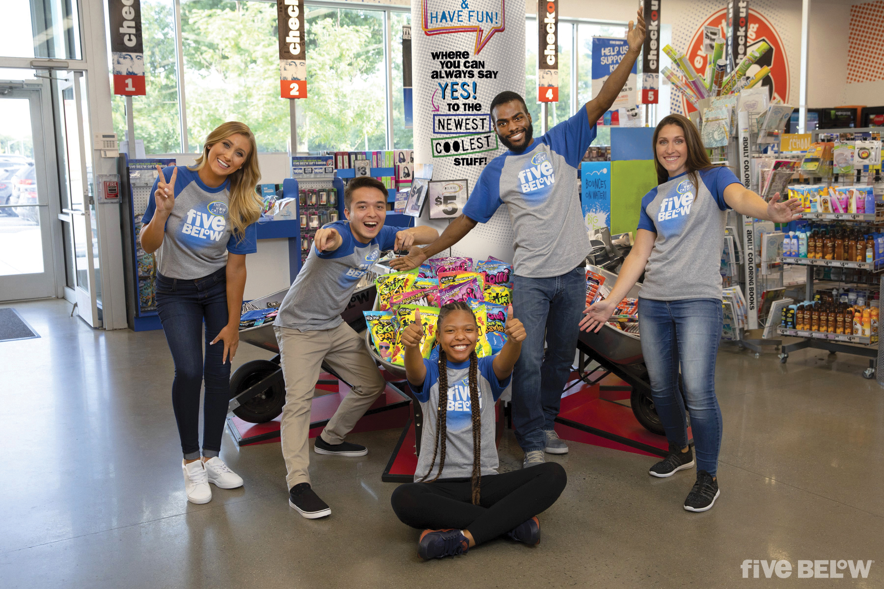Five Below employees having a good time in a store.