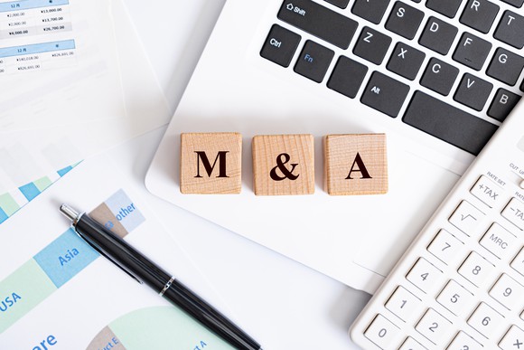Wooden blocks spelling the phrase M&A.