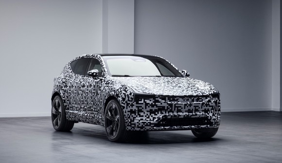 A preview image of the Polestar 3, a sleek electric SUV covered in black and white camouflage material. 