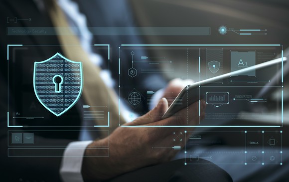 A digital depiction of access management software securing a person's tablet that's connected to the cloud. 