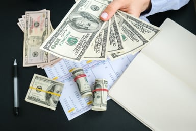 business person hand lots of cash money