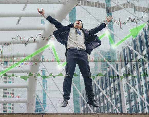 Investor appears to defy gravity while celebrating stock gains.