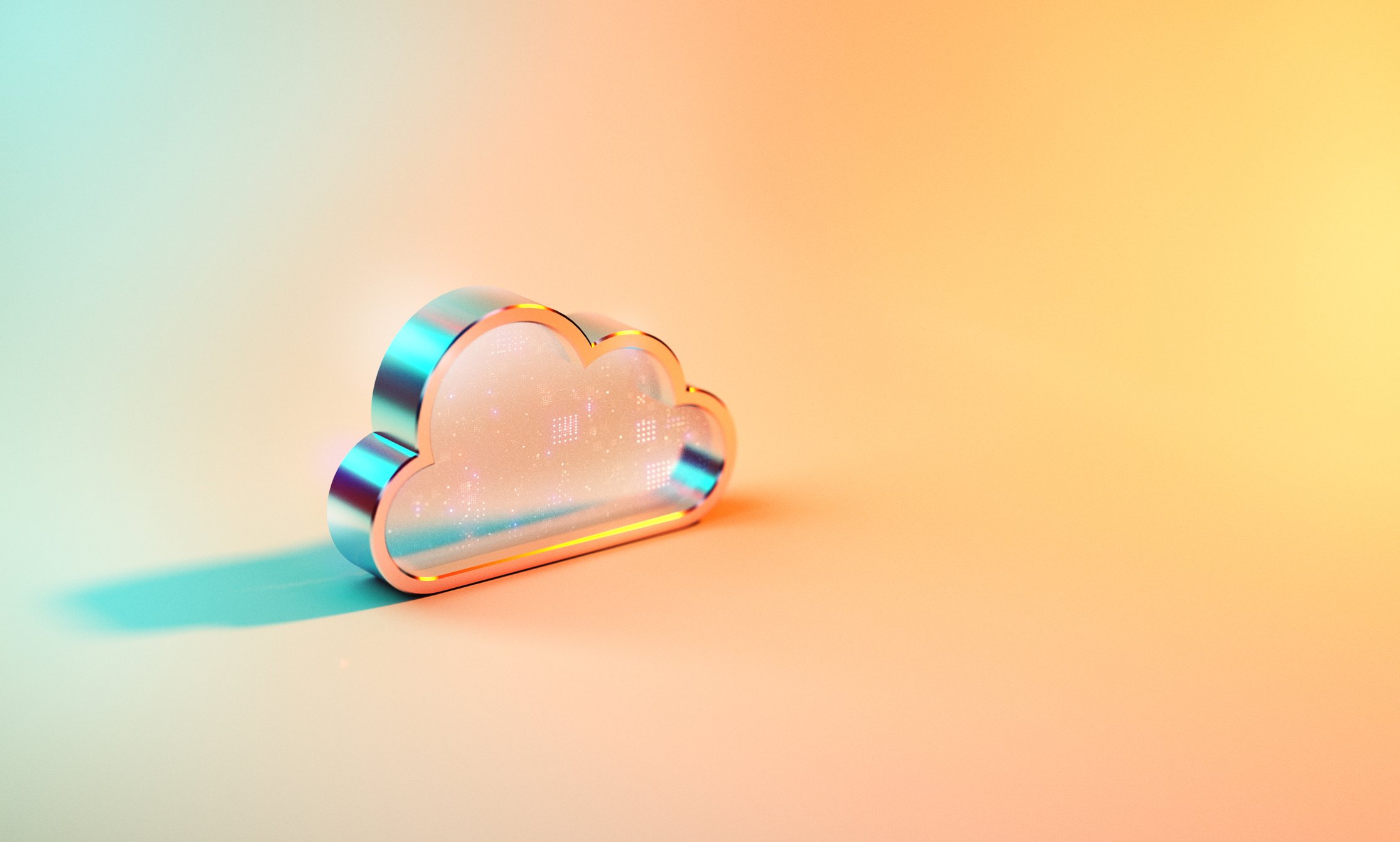 Cloud data icon sits on a hazy orange and blue backdrop.