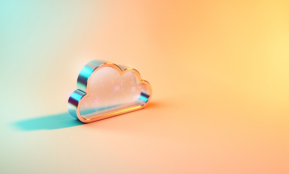 Cloud data icon sits on a hazy orange and blue backdrop.