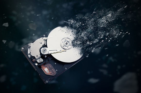 A hard disc against a black background. 