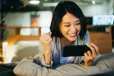 woman playing phone game
