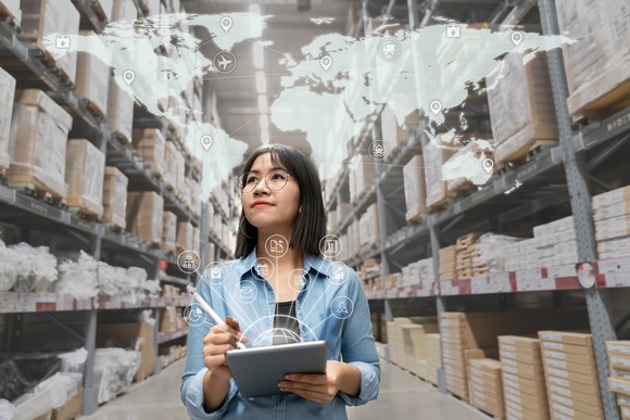Person browsing the inventory in a warehouse.