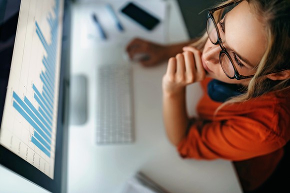 Smart investor looking for stocks to buy.