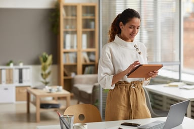 Lady Checking Her Stocks on a Tablet
