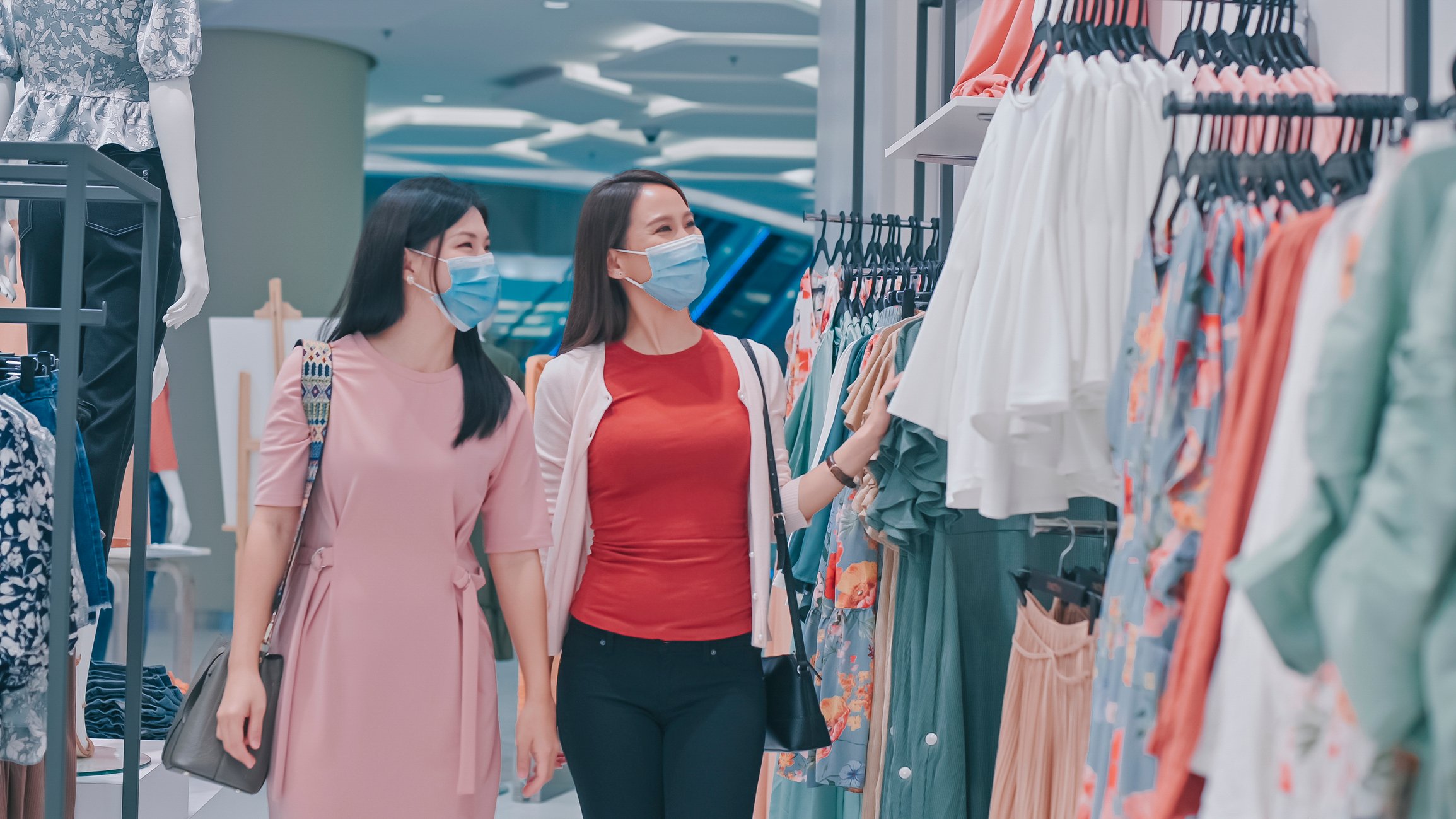Two people shopping in a store.