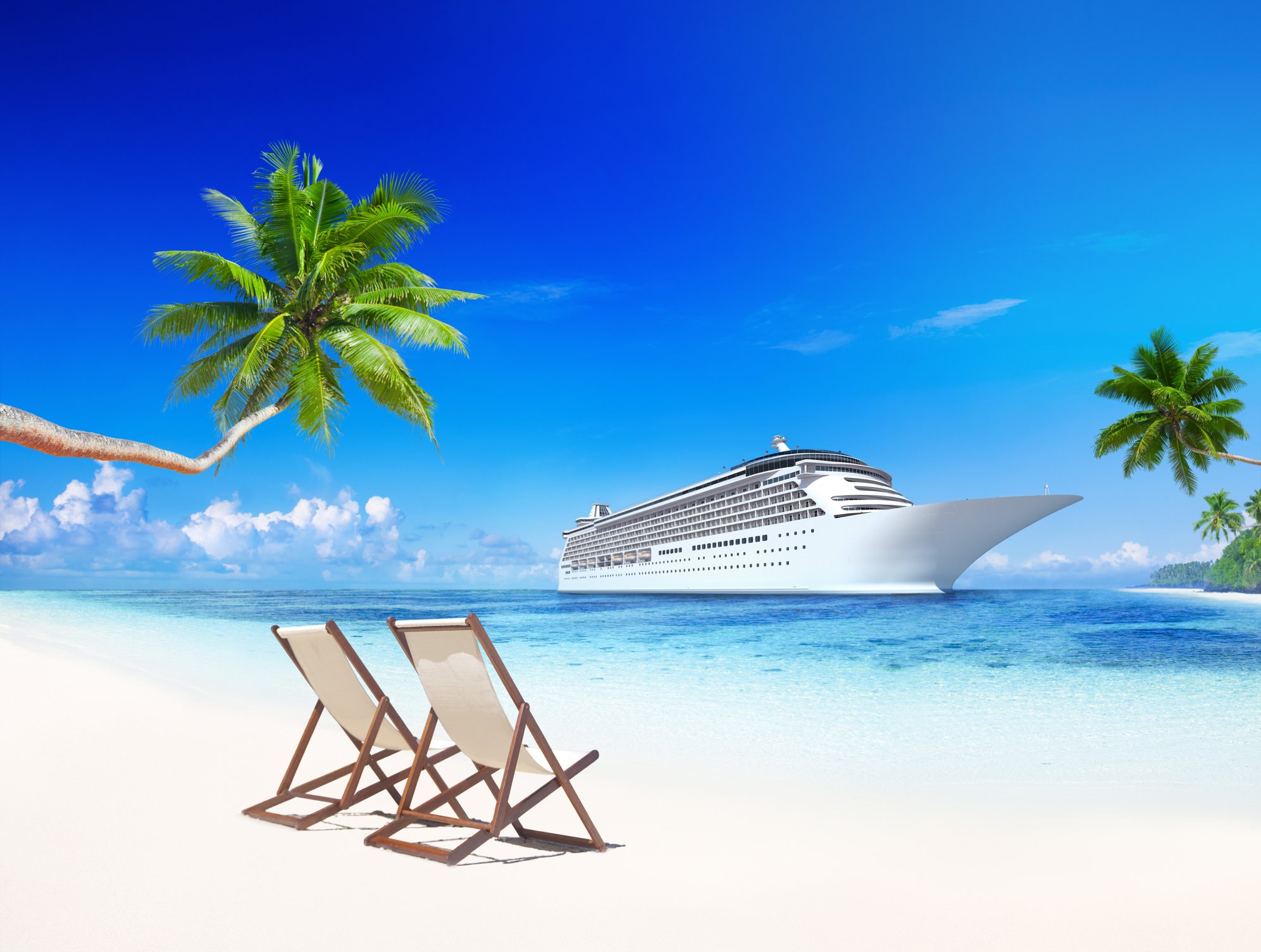 A cruise ship near a beach with two empty beach chairs. 