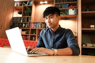 Asian Man Using Laptop