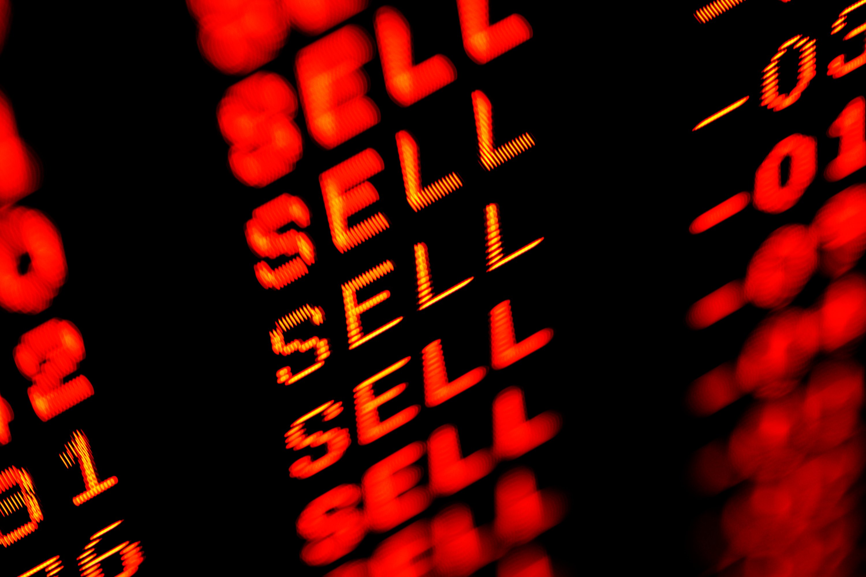 A stock screen with sell in red several times.