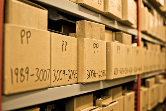 Archived boxes sit in storage.