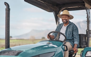 Man Riding on Tractor