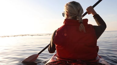 A person paddling a kayak_GettyImages-1186735634