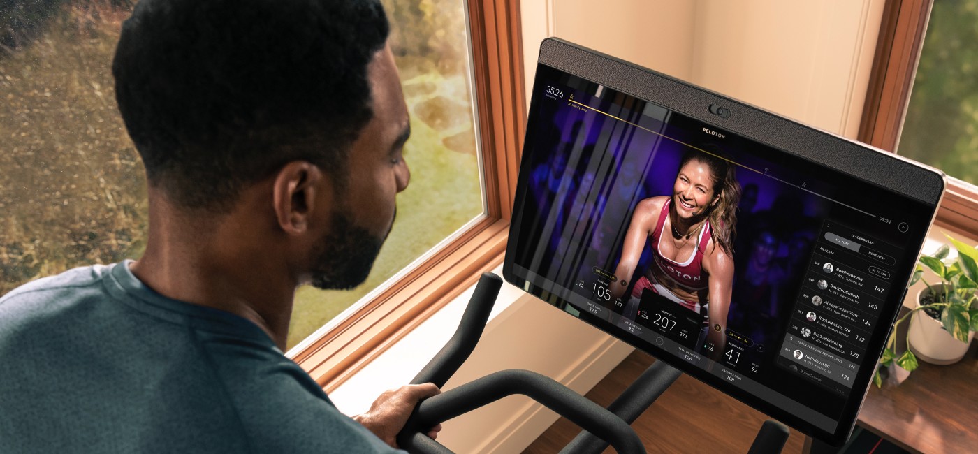 Man following connected exercise class