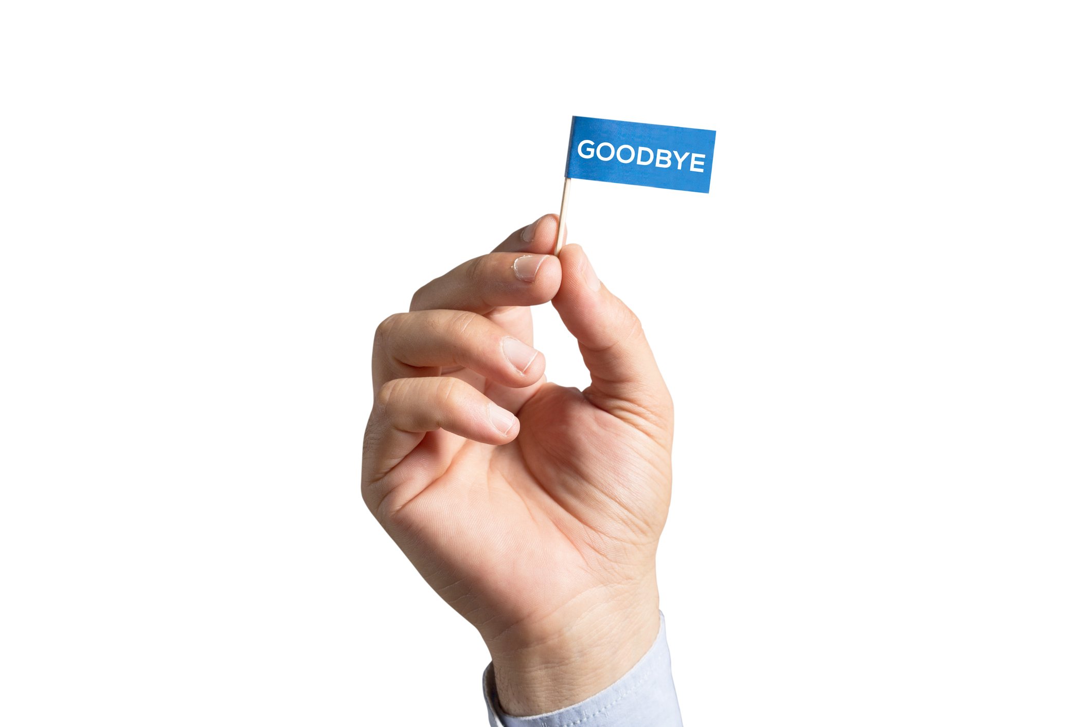 Hand holding a tiny sign saying "goodbye."
