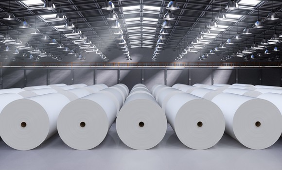 Paper rolls laid out in a warehouse. 