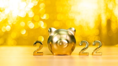 A golden piggy bank standing in as the '0' in '2022.'