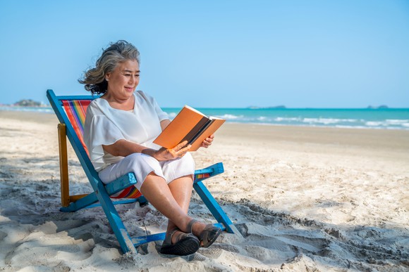 Person relaxing on a beach.