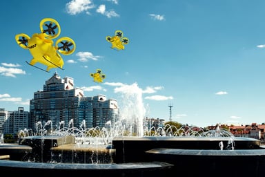 Yellow electric air taxis over a cityscape