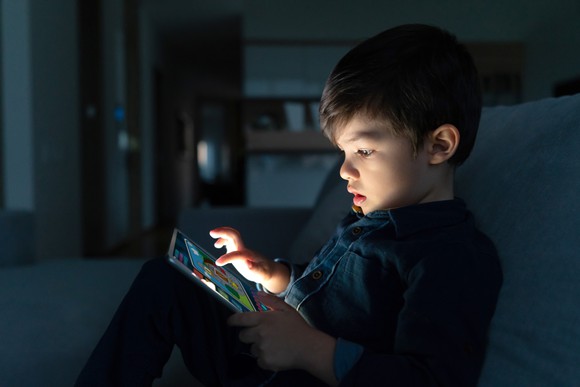 Child playing game on tablet PC