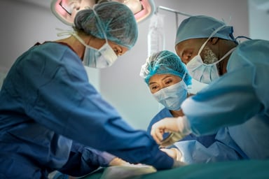 A team of surgeons work in the operating room