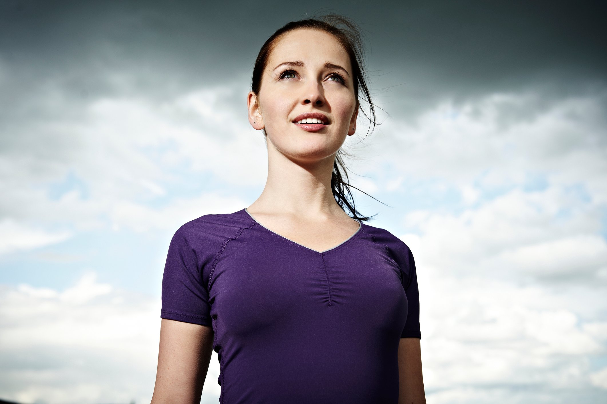A smiling person looking out over the horizon.