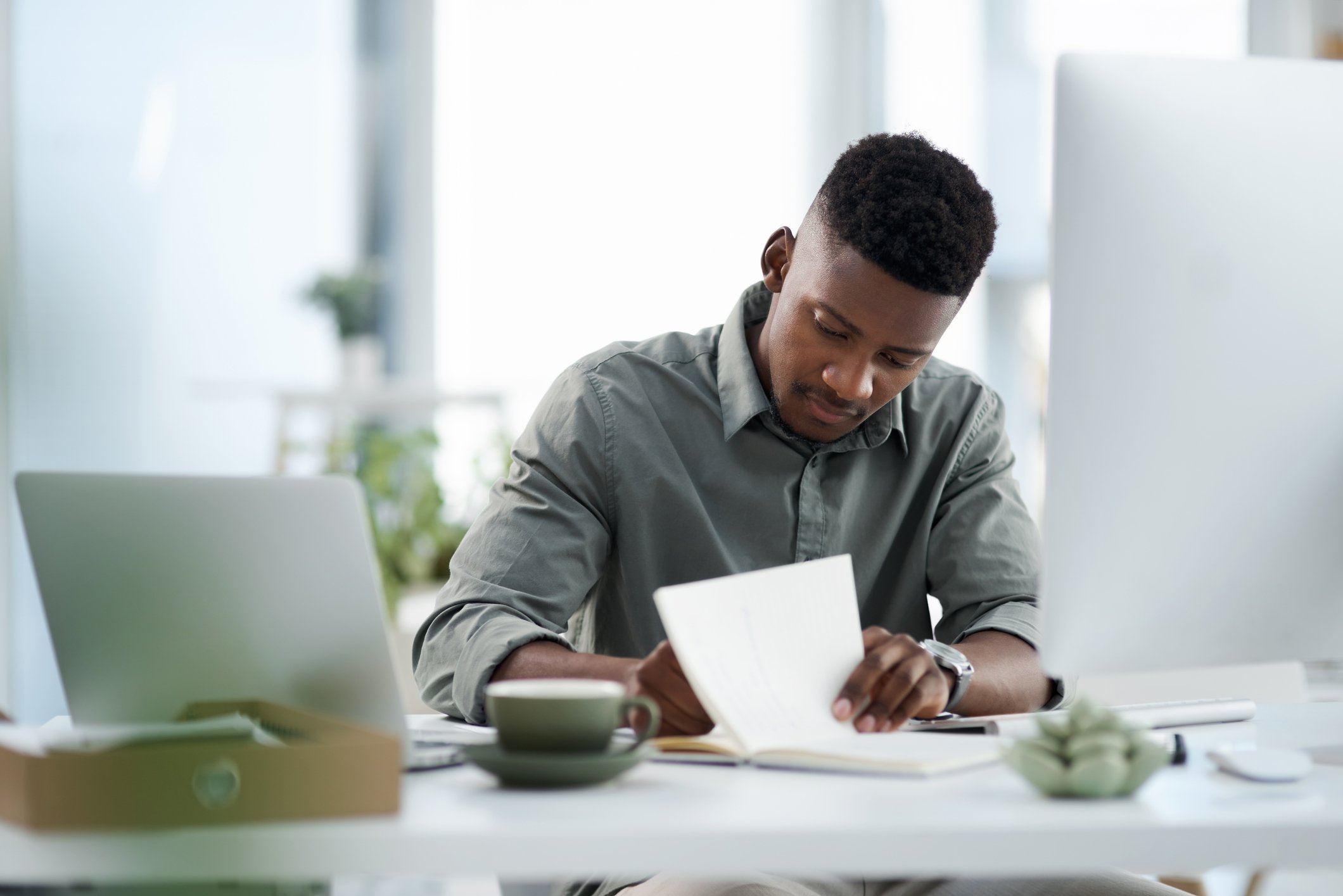 A person doing paperwork at a desk. 