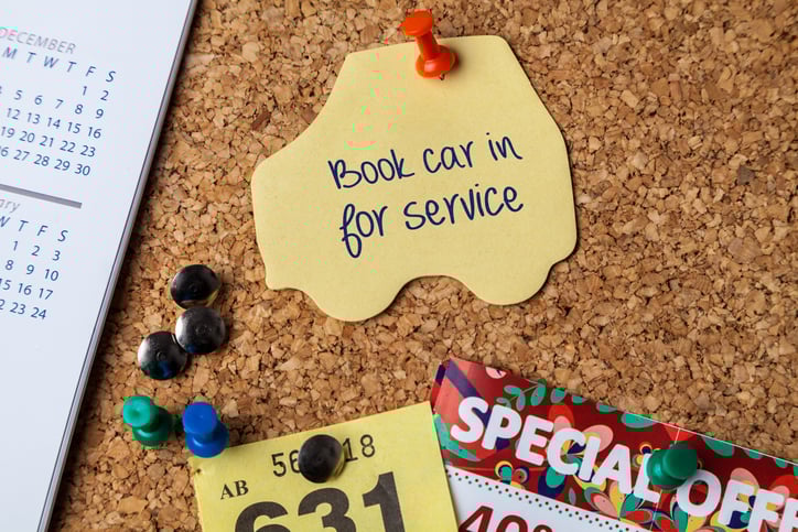 Bulletin board with reminder to bring car in for service
