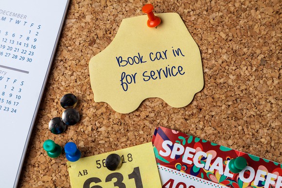 Bulletin board with reminder to bring car in for service