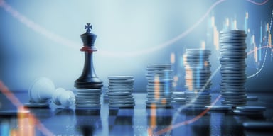 A rising stack of coins with a king chess piece.