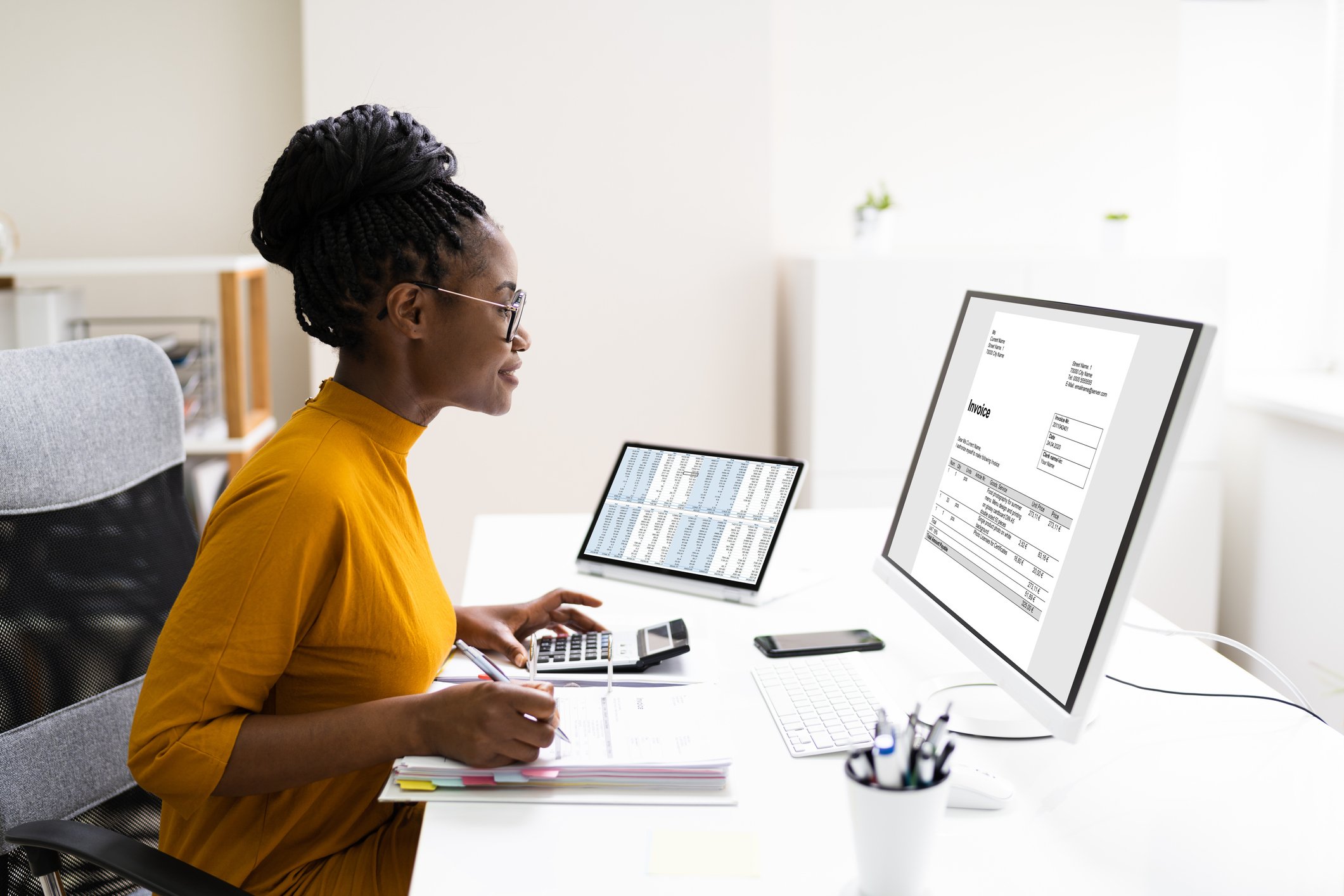 Person working at computer in office.