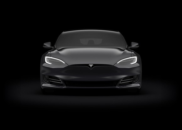front view of black Tesla. 