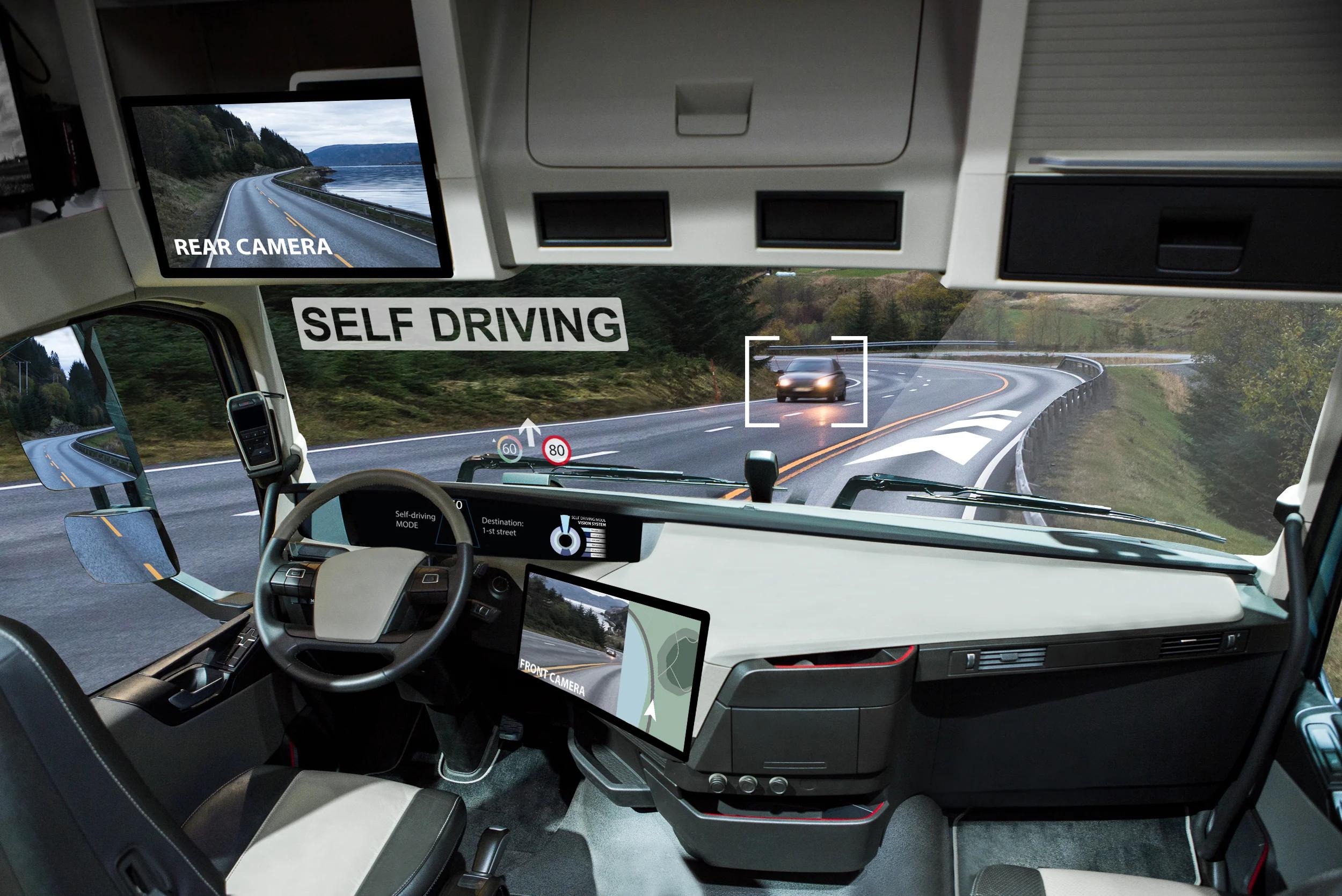 Driving compartment of commercial truck, showing self-driving platform features.