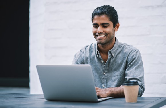 A person at a laptop.