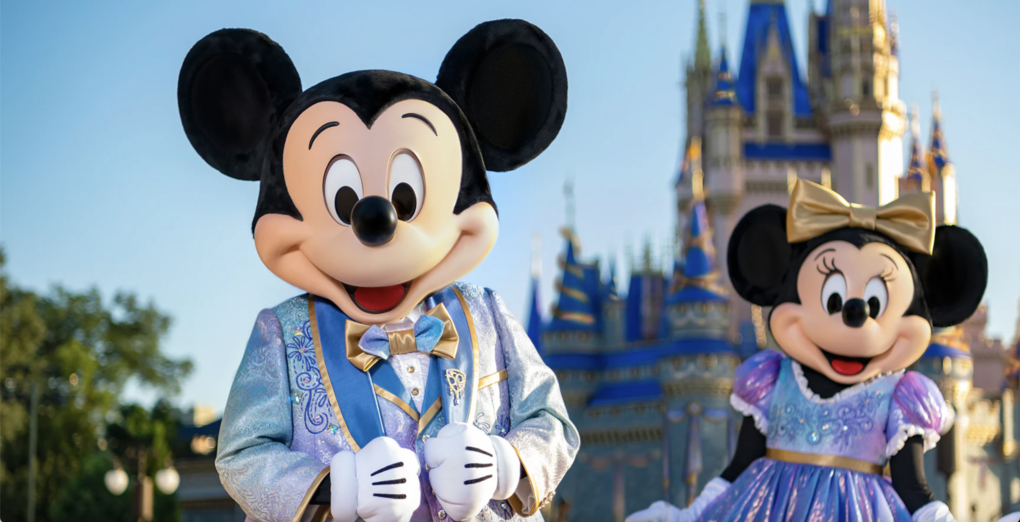 Mickey Mouse and Minnie Mouse in front of the castle at Disney World's Magic Kingdom.