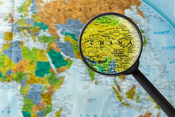 Map of China under a magnifying glass.