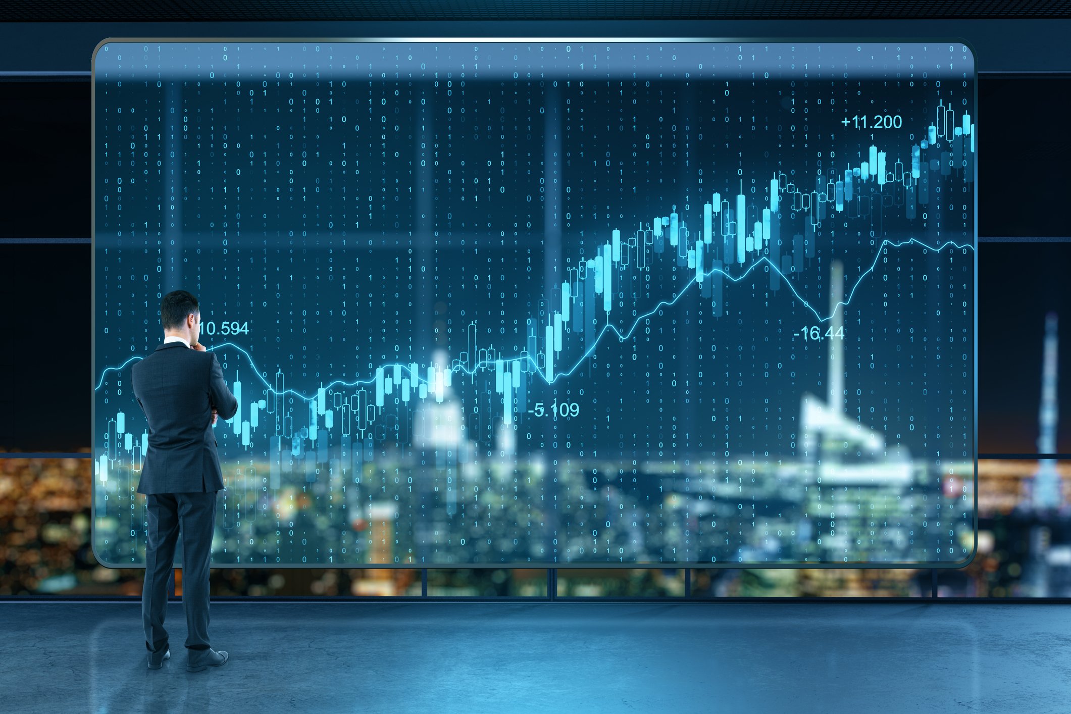 A person looking at a visual of a stock chart.