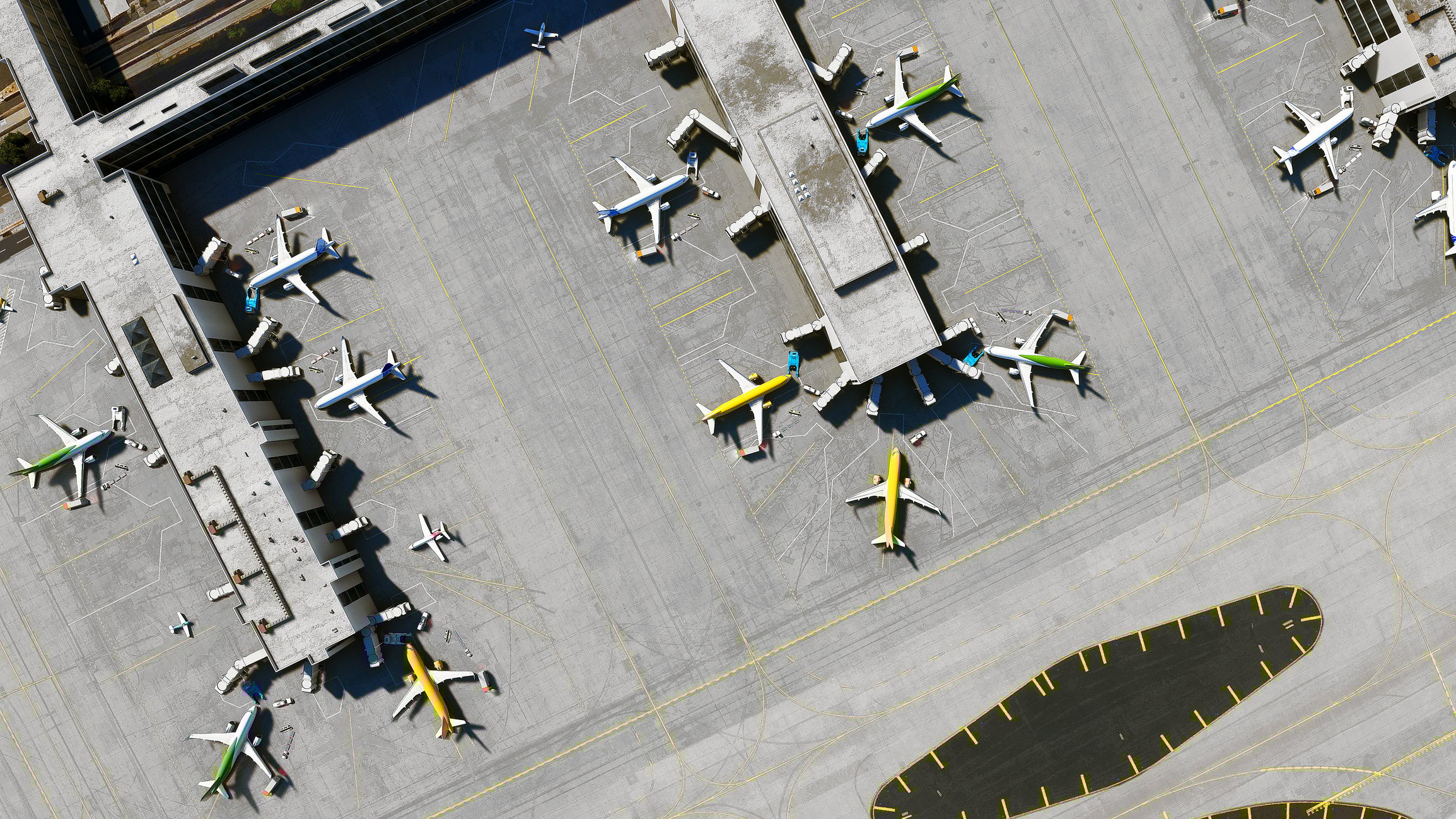 An overhead view of airplanes at an airport terminal.