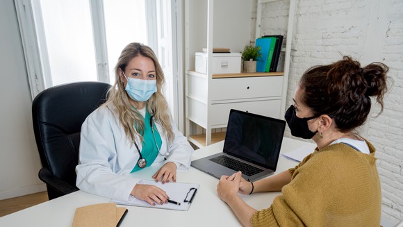 A doctor and patient at an appointment.