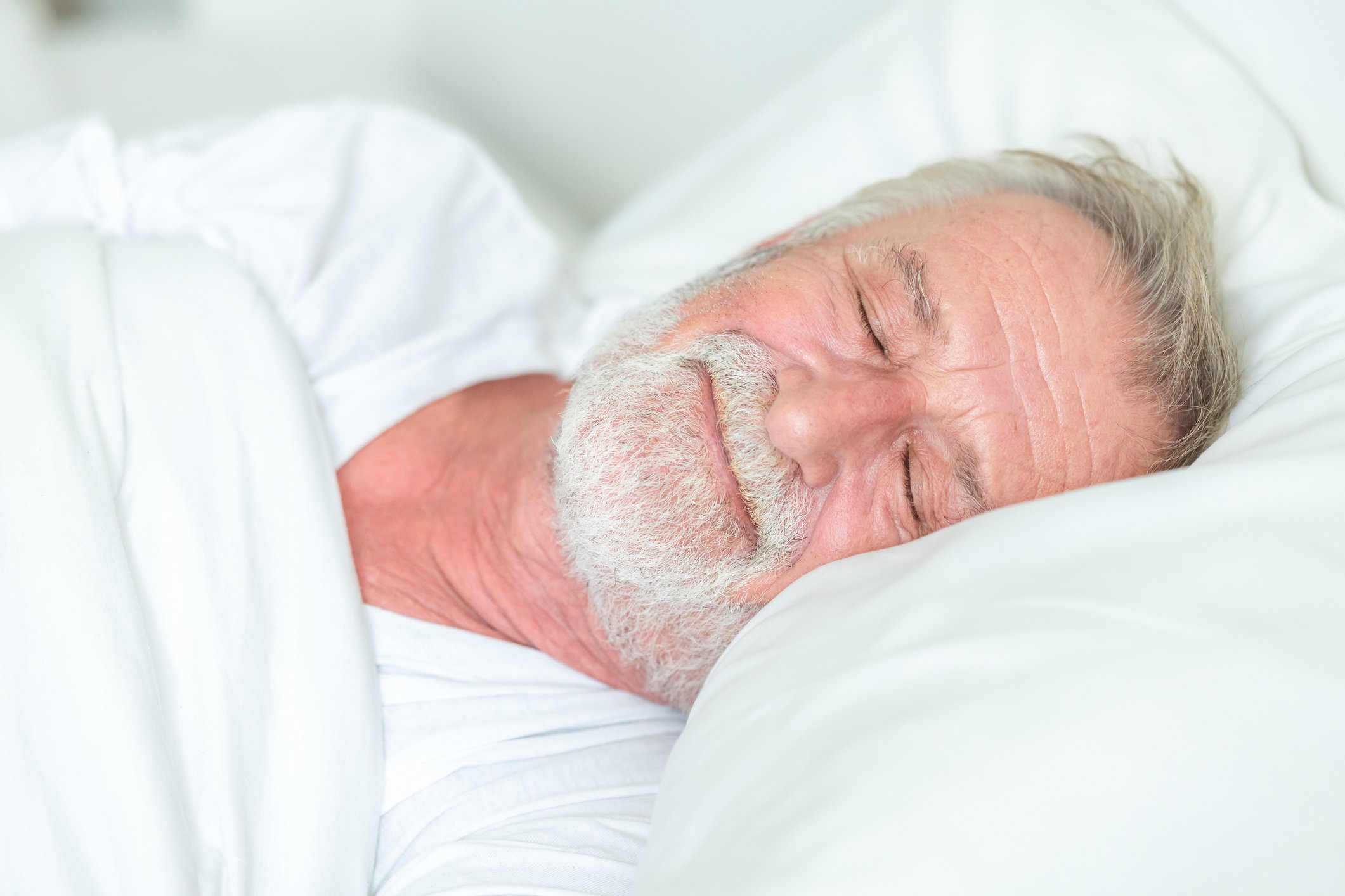 Elderly person enjoying a deep sleep.