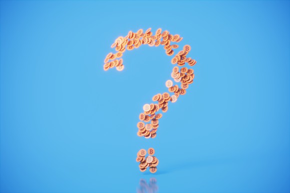 Question mark made by tokens on a blue background.