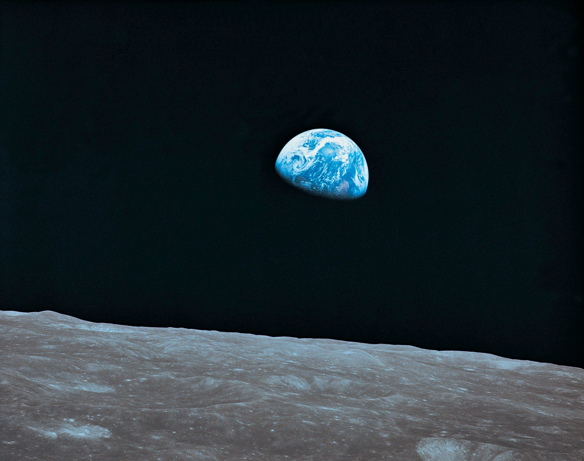 Earth as a blue marble seen from the moon.